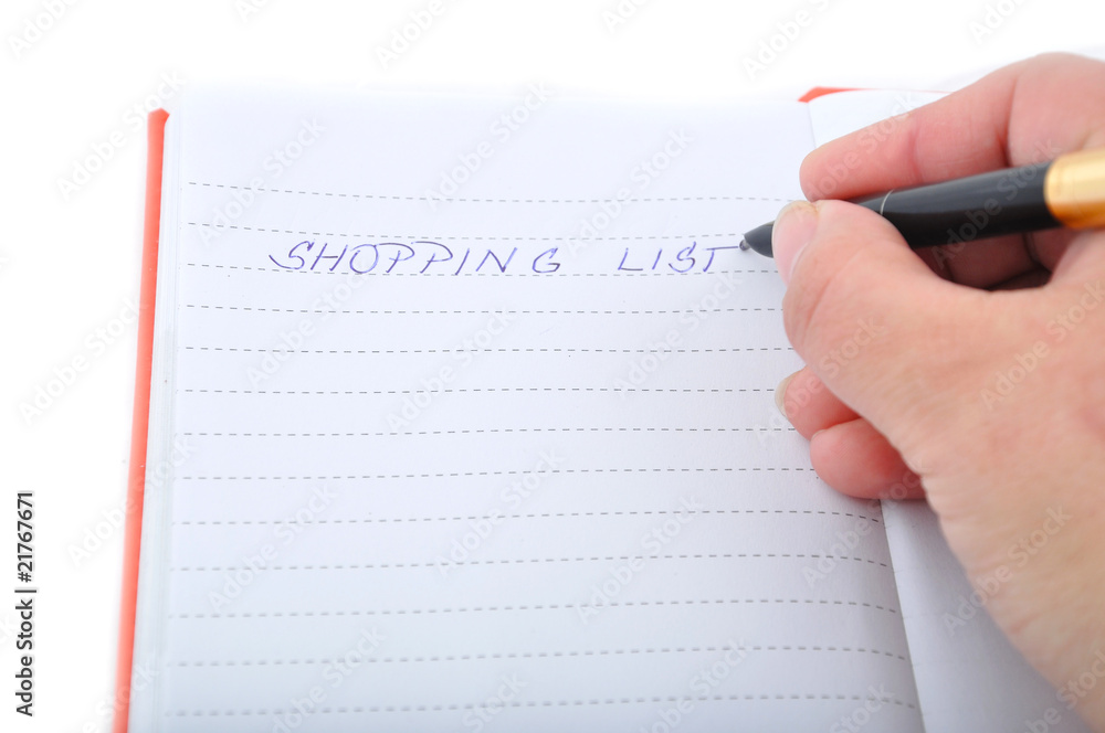 Hand is writing shoping list Hand is writing shoping list