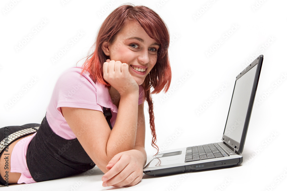 Teen happy young girl with laptop isolated on white Teen happy young girl with laptop isolated on white