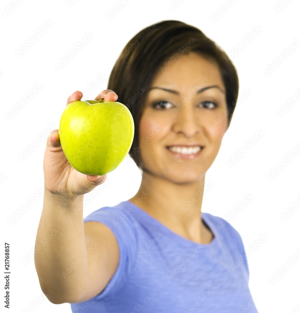 Young, ethnic woman holding a green apple Young, ethnic woman holding a green apple