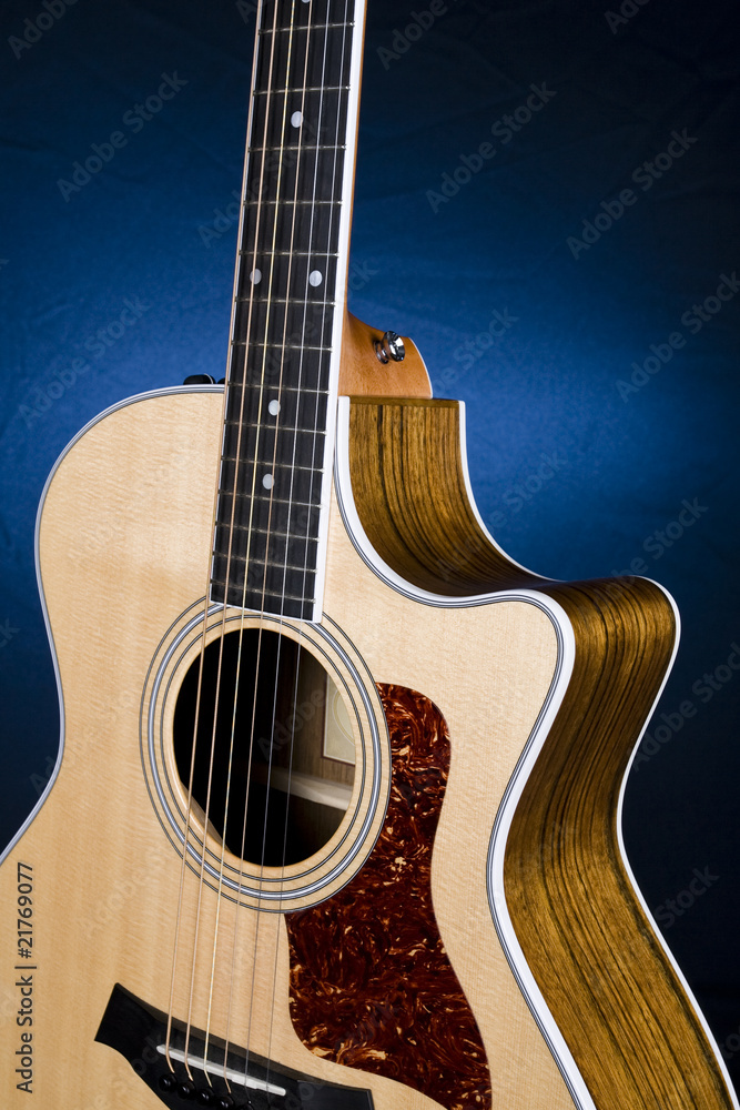 © shootforalivi35 - Guitar on blue backdrop