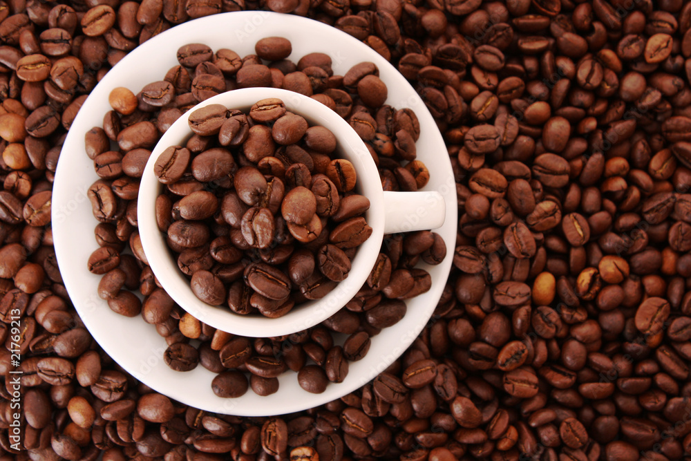 Fototapeta premium Small white cup of coffee with coffee grain on grain background