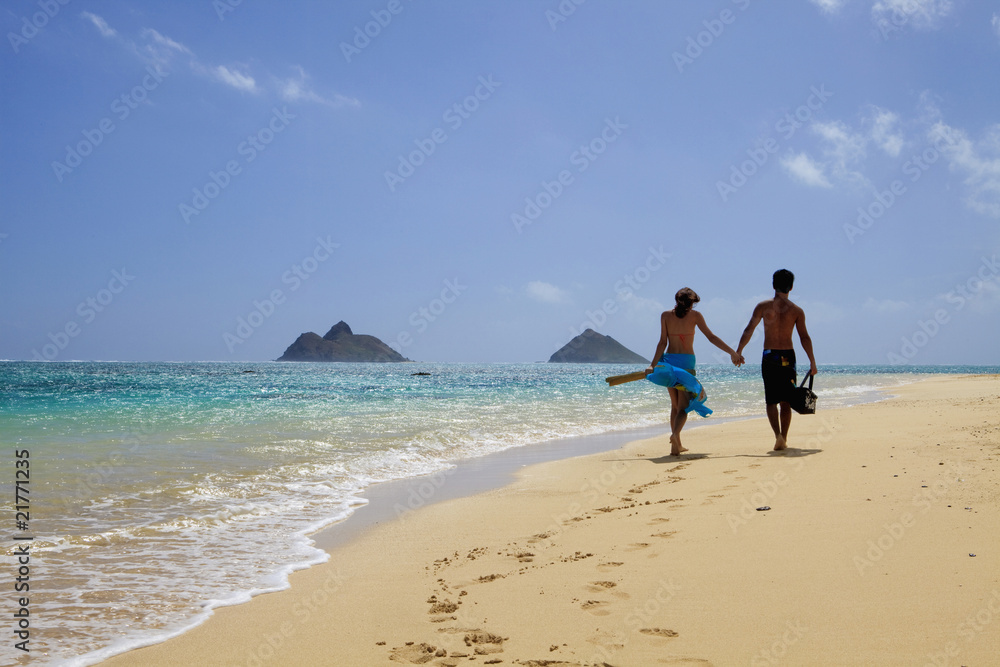 young couple at the beach in hawaii