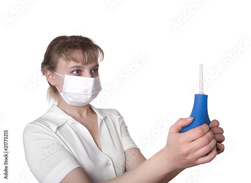 beautiful medical worker holding a blue enema photo