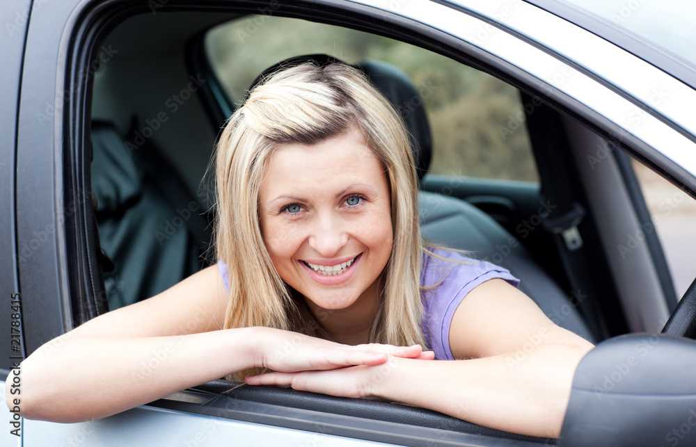 Portrait of a happy young female driver