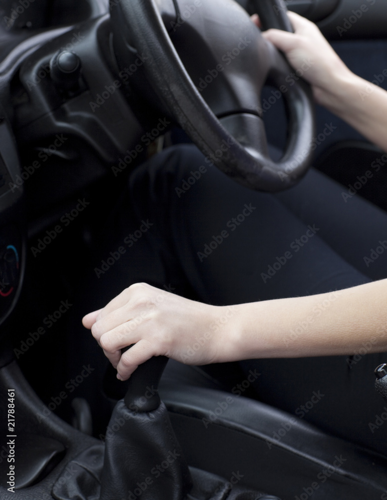 Female driver changing gear