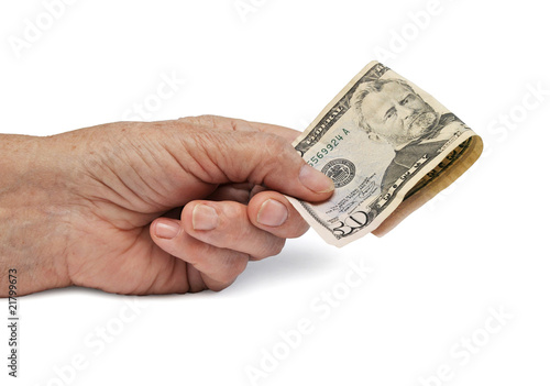 One hand holding US Dollar money