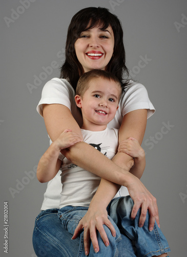 Mother holds her son in her arms