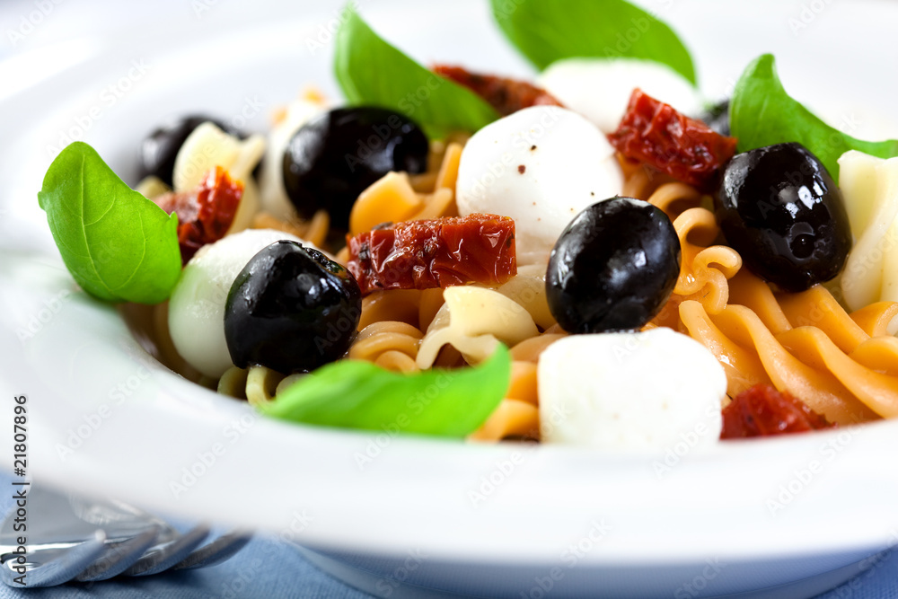 Pasta salad with mozzarella,dried tomatoes and olives Pasta salad with mozzarella,dried tomatoes and olives