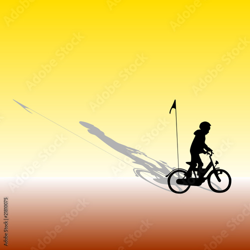 a boy rides a bike