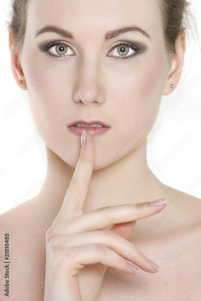 close up portrait of attractive young woman with finger at her l close up portrait of attractive young woman with finger at her l