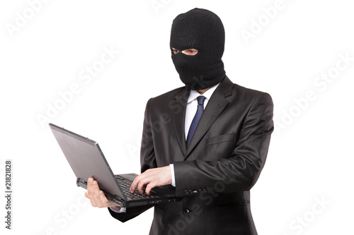 A hacker working on a laptop isolated on white background