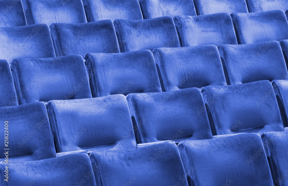 Rows of blue seats at an modern university auditorium Rows of blue seats at an modern university auditorium