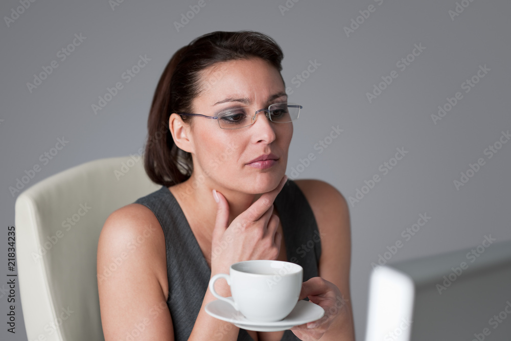 Successful business woman having coffee break Successful business woman having coffee break
