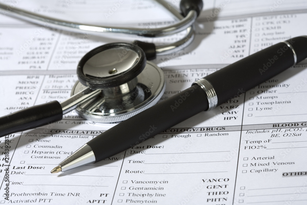 Stethoscope, a pen and a blank prescription pad Stethoscope, a pen and a blank prescription pad
