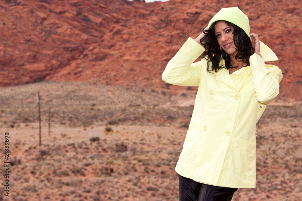 Fototapeta premium Young African American woman in raincoat