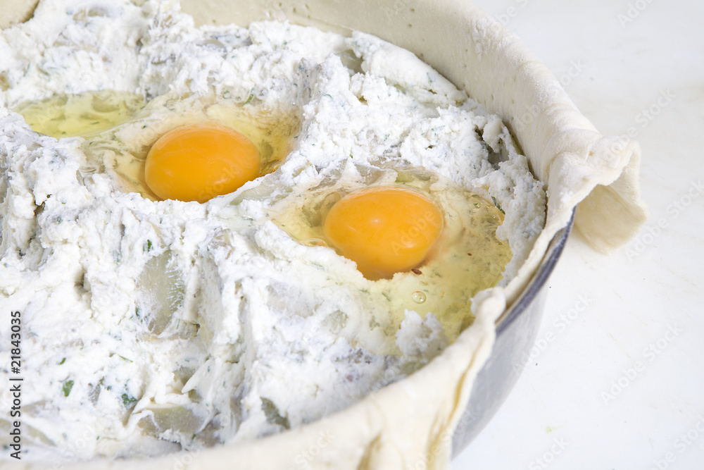 preparing Easter pie. Eggs in stuffing preparing Easter pie. Eggs in stuffing