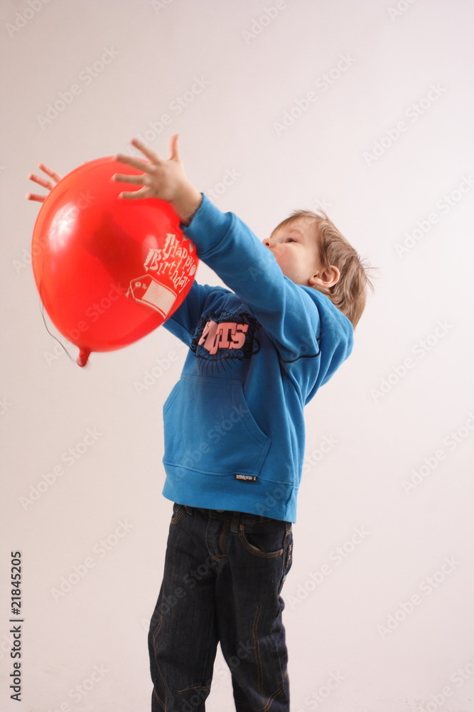 little boy playing with a balloon little boy playing with a balloon