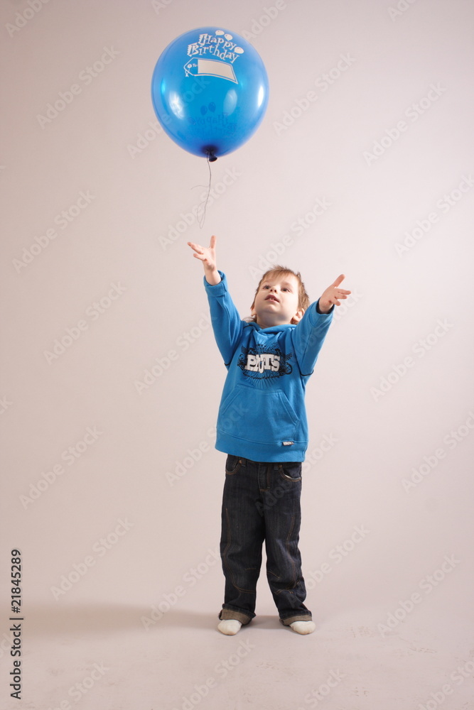 little boy playing with a balloon little boy playing with a balloon