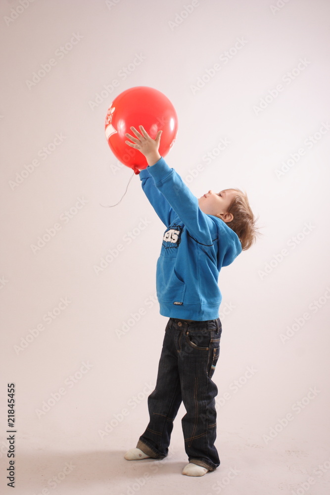little boy playing with a balloon little boy playing with a balloon