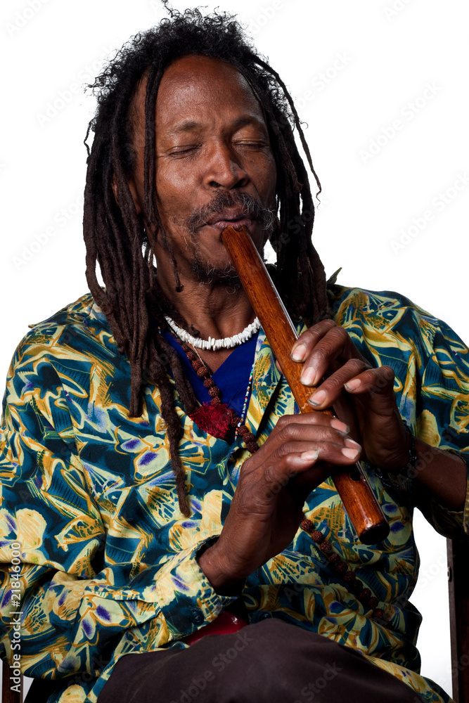 Obraz premium Rastafarian playing the flute