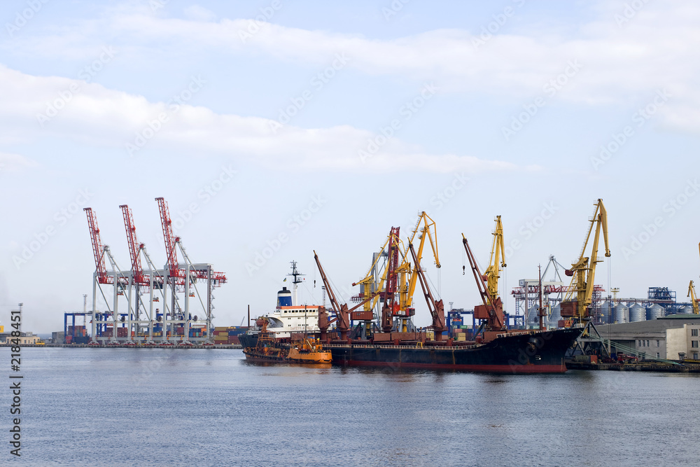 port with cargo cranes and vessel