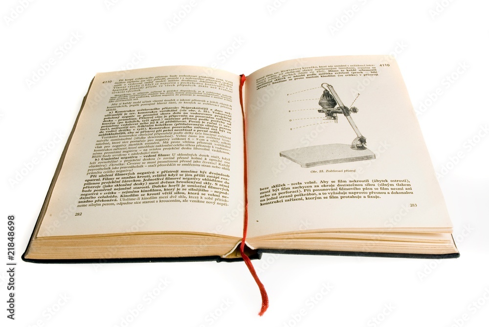 Fototapeta premium Open old book with enlarger on white background