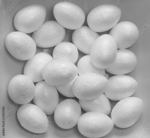 Abstract polystyrene eggs on grey