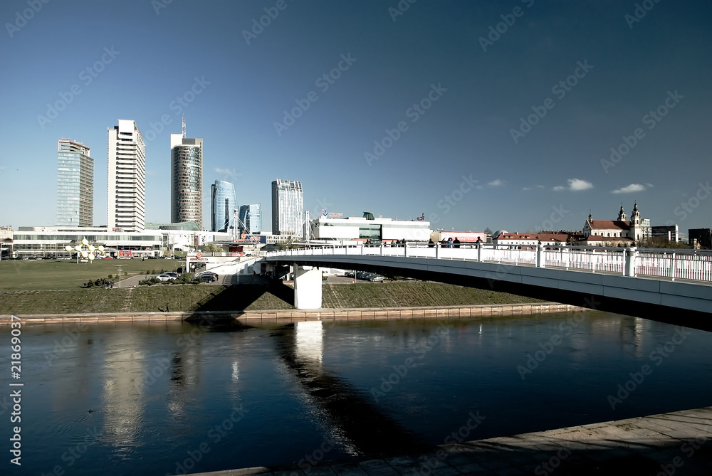 A bridge, river, skyscrapers