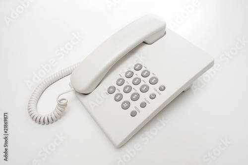 Office phone with sign of money instead of numbers.