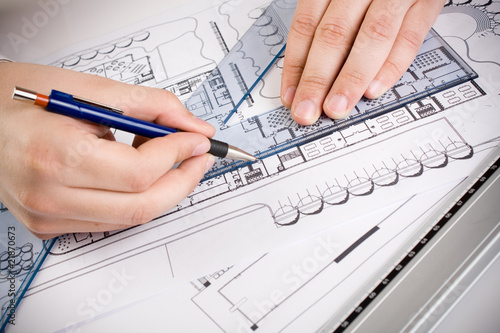 Architectural plans and blueprints in office