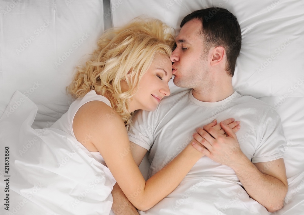 Young couple sleeping in a bed Young couple sleeping in a bed