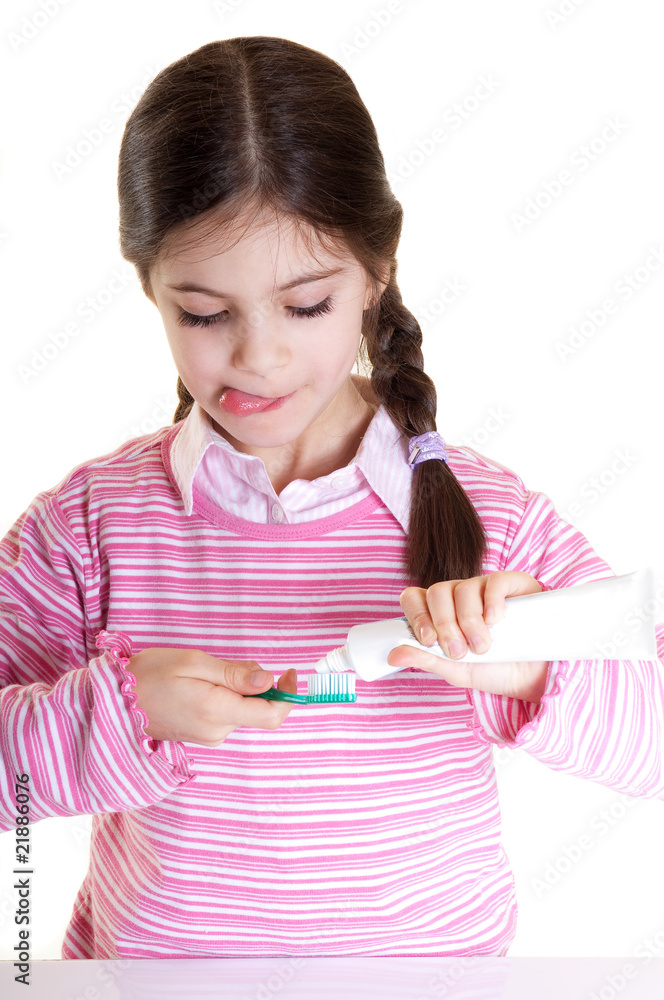 happy child preparing brush with tooth paste happy child preparing brush with tooth paste
