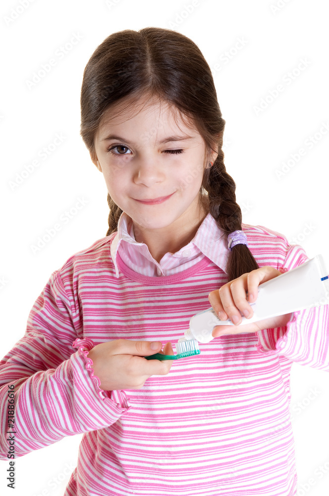 happy child preparing brush with tooth paste happy child preparing brush with tooth paste