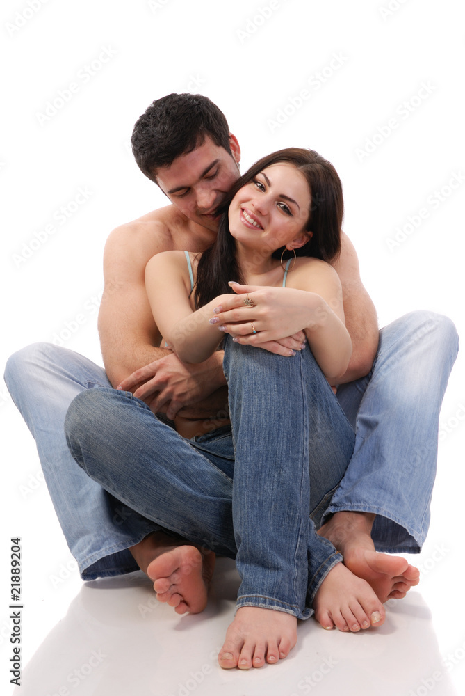 a beautiful young couple posing in studio a beautiful young couple posing in studio