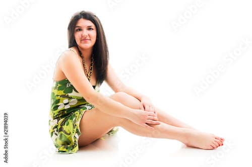 Woman sitting on white floor