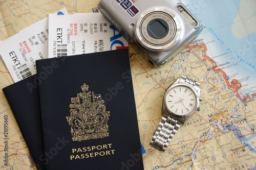 Passport, air ticket, camera and map.