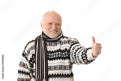 Фотография Portrait of happy senior man with thumb up