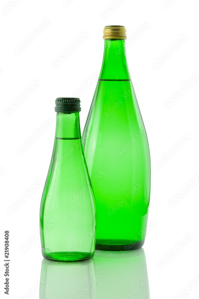 Bottles of mineral water reflected on white background Bottles of mineral water reflected on white background