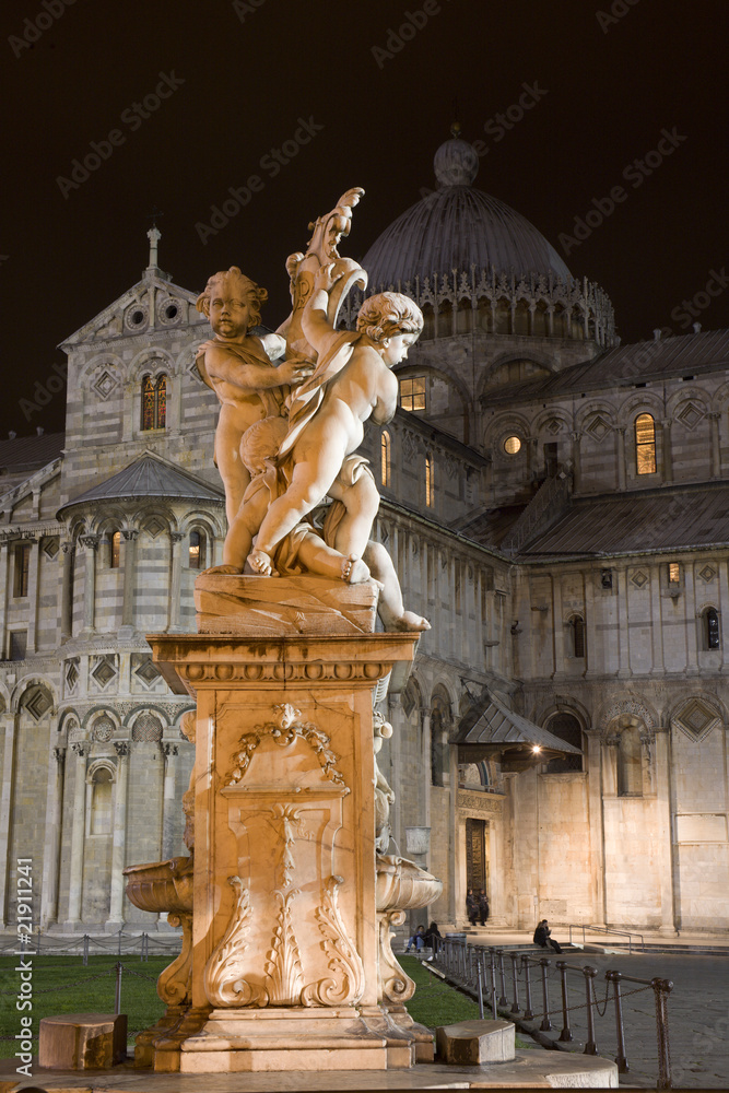 Pisa - statue of angles and cathedral in the night