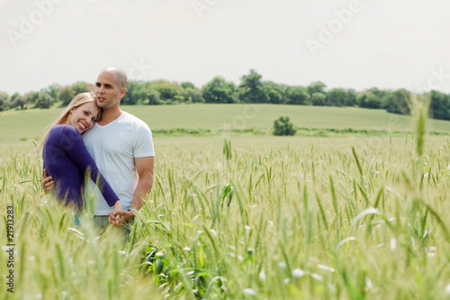 Shot of young couple hugging and holding hands