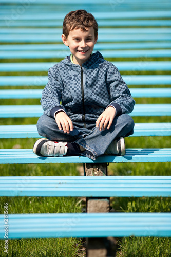 Cute schoolboy in a park