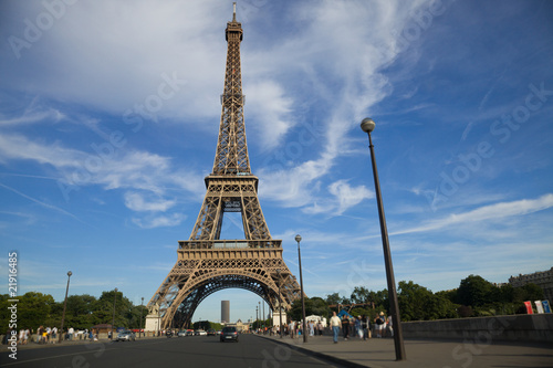 Eiffel Tower panoramic near sunset, with blurred people