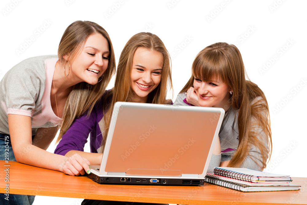 three teenager girls surfing the net