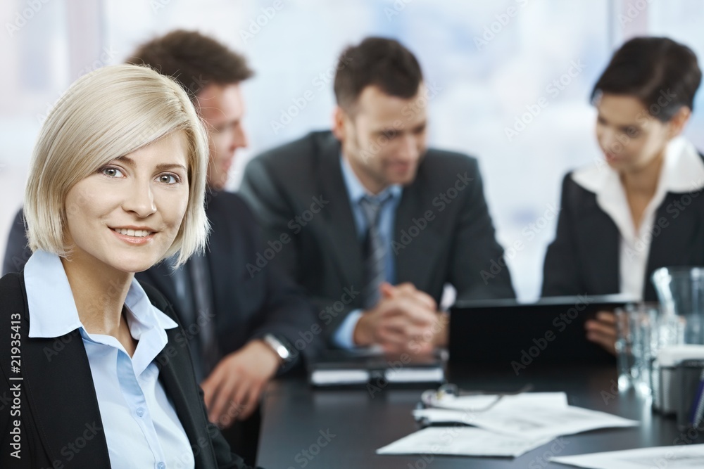 Smiling businesswoman portrait at meeting Smiling businesswoman portrait at meeting