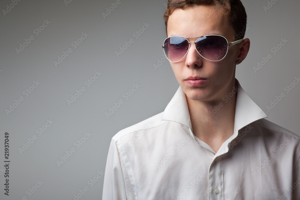 portrait of young handsome man in sunglasses portrait of young handsome man in sunglasses