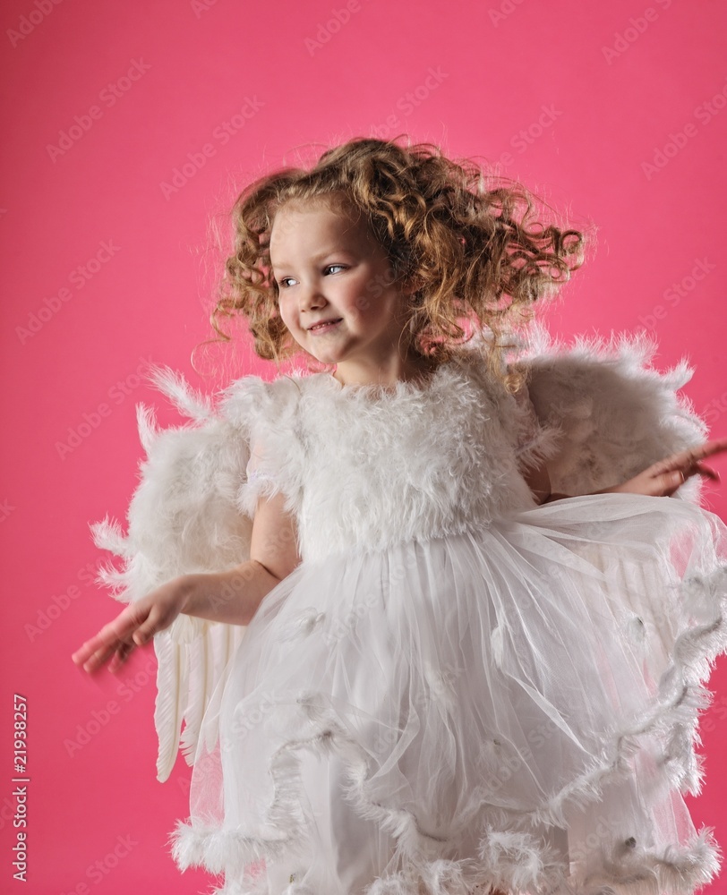 Beautiful little angel girl isolated on pink background Beautiful little angel girl isolated on pink background