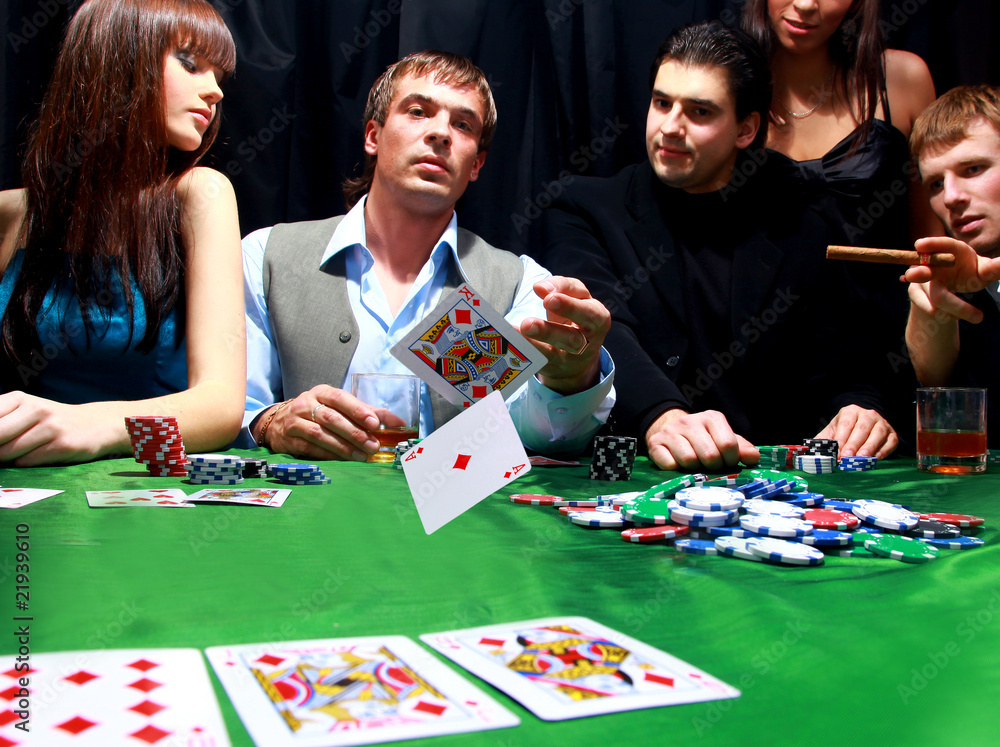 Young man throwing chips on the table while playing cards. Young man throwing chips on the table while playing cards.