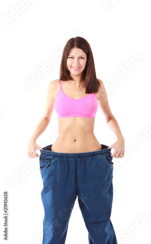 Woman showing how much weight she lost