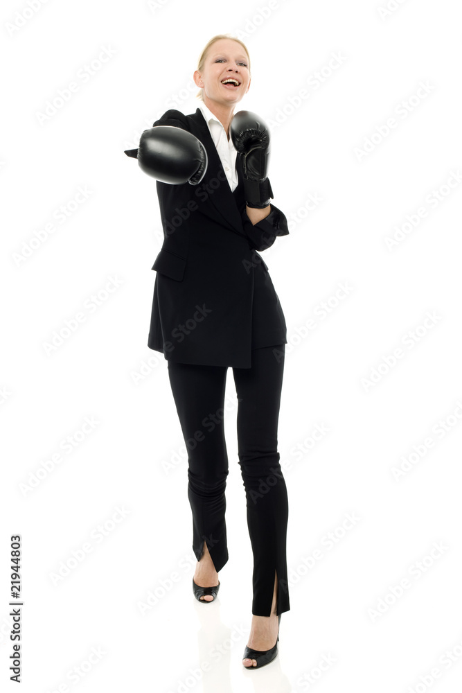 businesswoman smiling with boxing gloves businesswoman smiling with boxing gloves