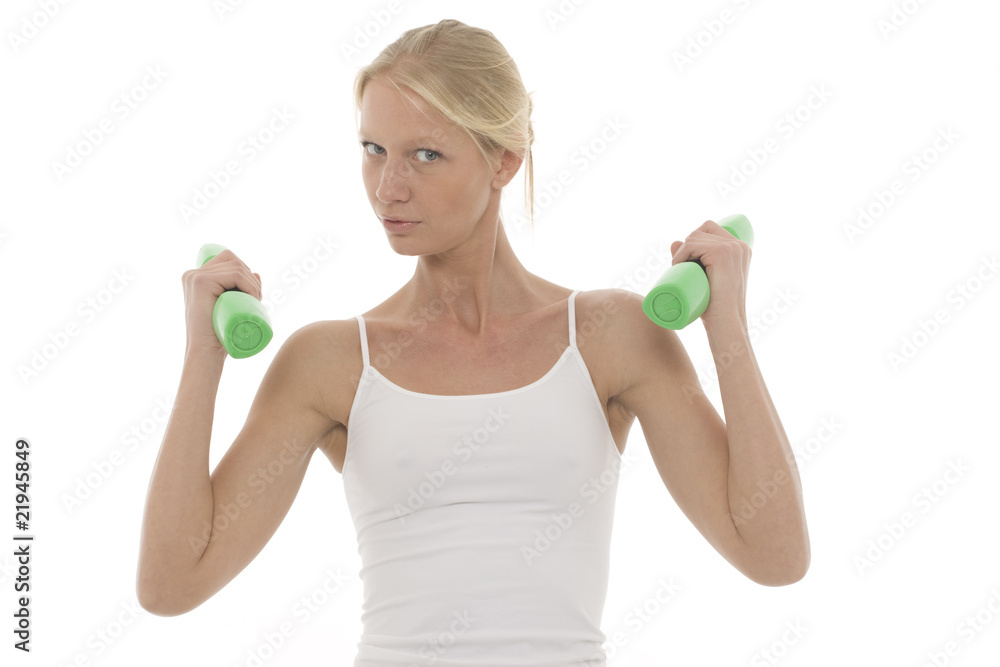 a young caucasian woman who trains with dumbbells in hand a young caucasian woman who trains with dumbbells in hand